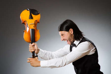 Man playing violin in musical conceptの写真素材