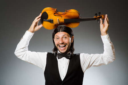 Man playing violin in musical conceptの写真素材