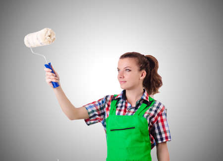 Woman painter with paintbrush against gradientの写真素材