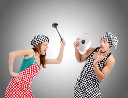 Pair of funny cooks against gradientの写真素材