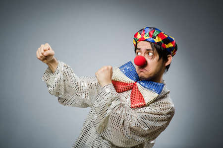 Funny clown against dark backgroundの写真素材