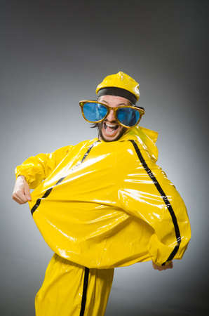 Man wearing yellow suit in funny concept