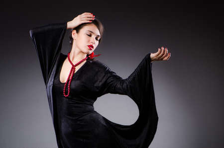 Woman portrait against dark backgroundの写真素材