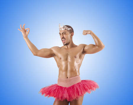 Man in ballet tutu against the gradientの写真素材