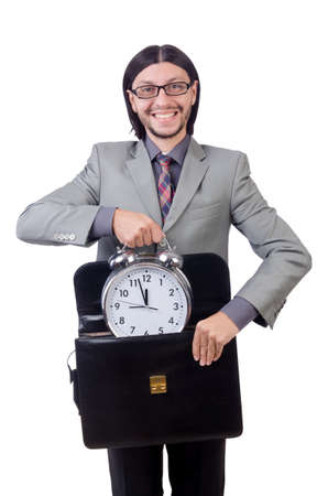 Young businessman holding briefcase and alarm clock isolated on whiteの写真素材