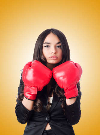 Young woman with boxing gloveの写真素材