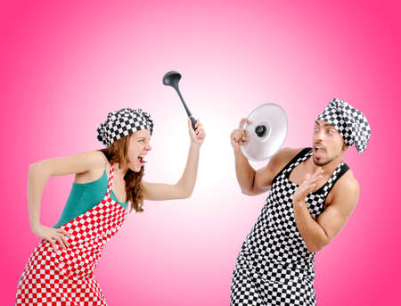 Pair of funny cooks against gradientの写真素材