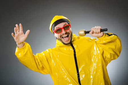 Man wearing yellow suit with mic