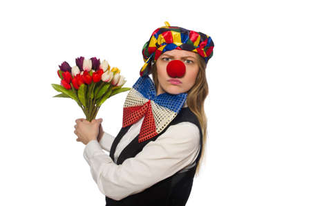 Pretty female clown with flowers isolated on whiteの写真素材