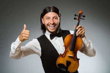 Man playing violin in musical conceptの写真素材