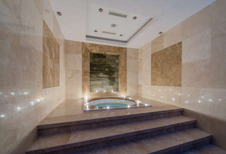 Spa room with burning candlesの写真素材