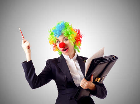 Woman clown in business suitの写真素材
