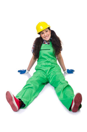 Female workman in green overalls isolated on whiteの写真素材