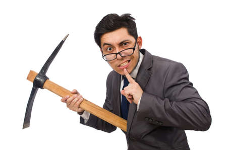 Young businessman holding a tool isolated on white