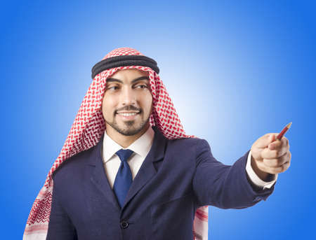Arab man pressing virtual buttonsの写真素材