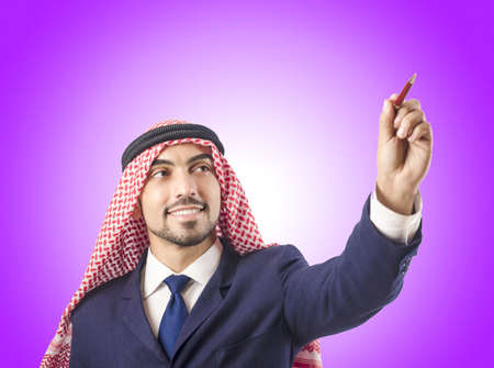 Arab man pressing virtual buttonsの写真素材
