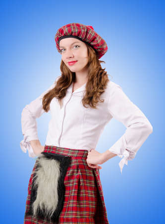 Young woman in traditional scottish clothingの写真素材