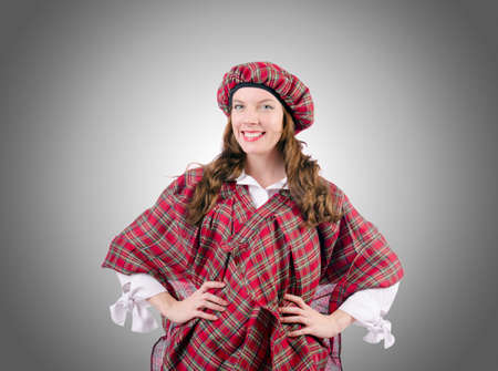 Young woman in traditional scottish clothingの写真素材