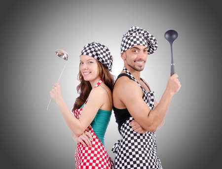 Pair of funny cooks against gradientの写真素材