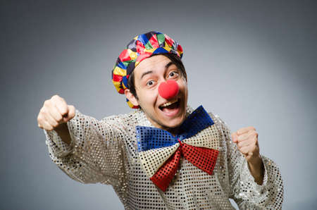 Funny clown against dark backgroundの写真素材