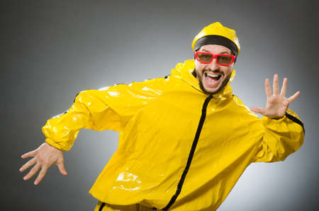 Funny man wearing yellow suitの写真素材