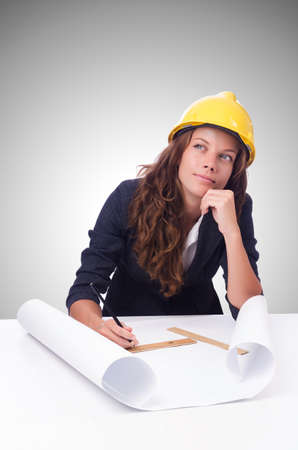 Woman architect with drawings against gradientの写真素材