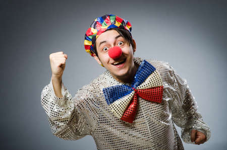 Funny clown against dark backgroundの写真素材