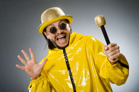 Man wearing yellow suit with micの写真素材