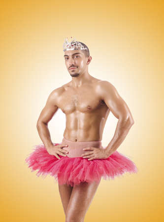 Man in ballet tutu against the gradientの写真素材