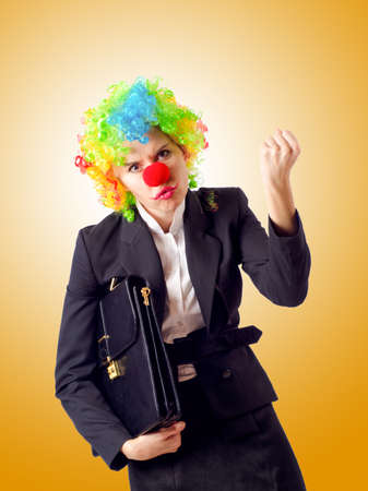 Woman clown in business suitの写真素材