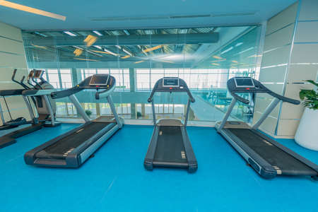 Modern gym with various sports equipment