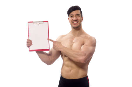 Muscular man with blank pad for your messageの写真素材