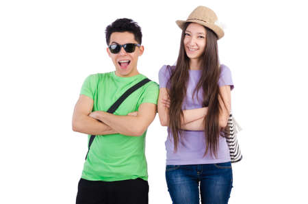 Girl and boy with suitcase isolated on whiteの写真素材