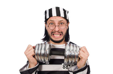 Prison inmate with dumbbells isolated on whiteの写真素材