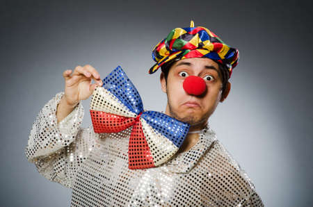 Funny clown against dark backgroundの写真素材