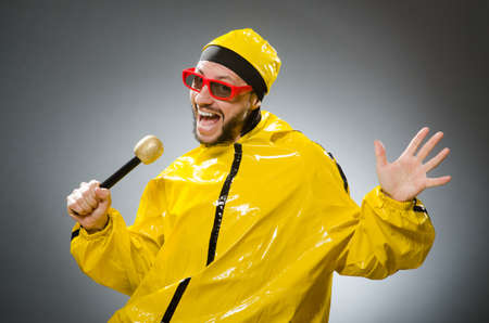 Man wearing yellow suit with mic