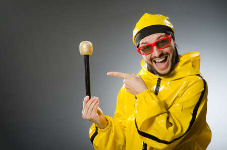 Man wearing yellow suit with micの写真素材