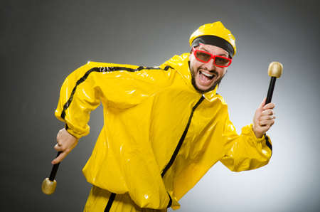 Man wearing yellow suit with mic