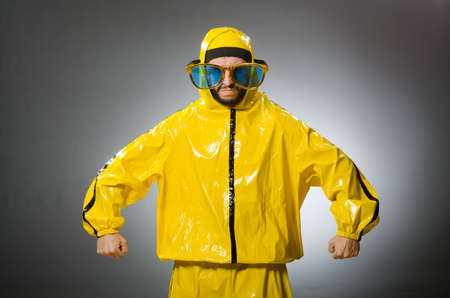 Man wearing yellow suit in funny conceptの写真素材