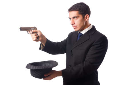 Young elegant man holding handgun isolated on whiteの写真素材