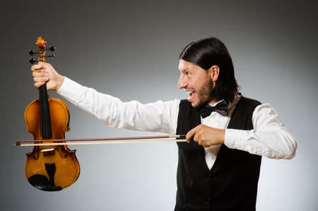 Man playing violin in musical conceptの写真素材