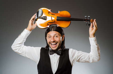 Man playing violin in musical conceptの写真素材