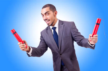 Businessman with dynamite against the gradientの写真素材
