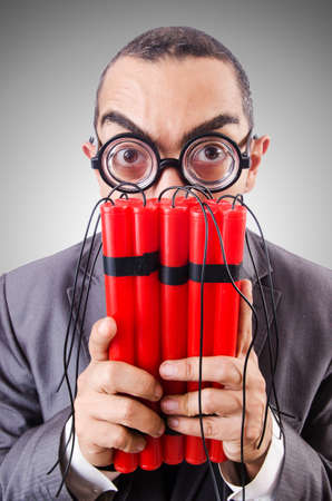 Businessman with dynamite against the gradient