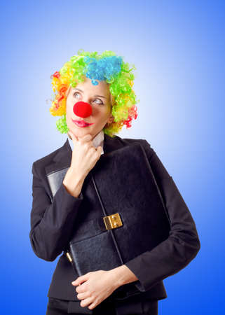 Woman clown in business suitの写真素材