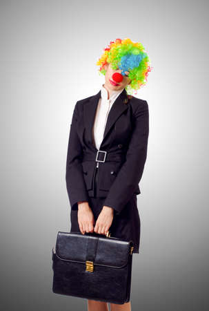 Woman clown in business suitの写真素材