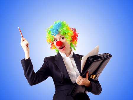Woman clown in business suitの写真素材