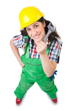 Female workman in green overalls holding key isolated on whiteの写真素材