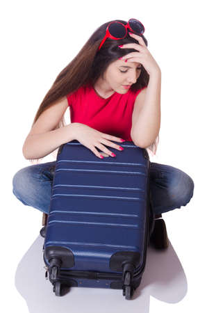Pretty girl with suitcase isolated on whiteの写真素材
