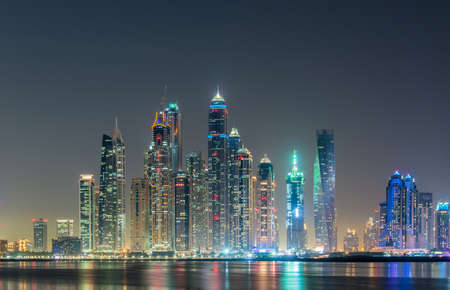 Dubai marina skyscrapers during night hoursの写真素材